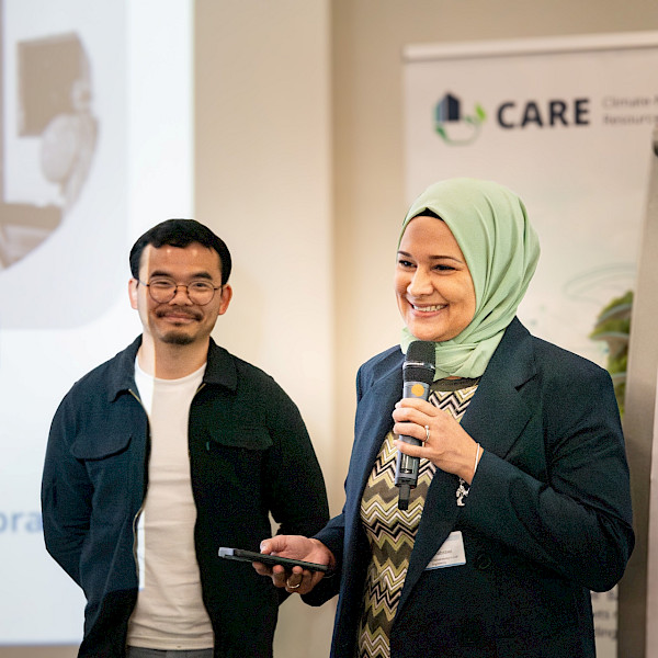 A woman and a man delivering a presentation